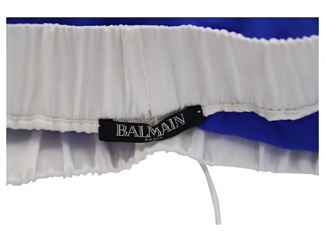 Pantalones cortos de satén con cinturilla blanca en seda azul de Balmain 